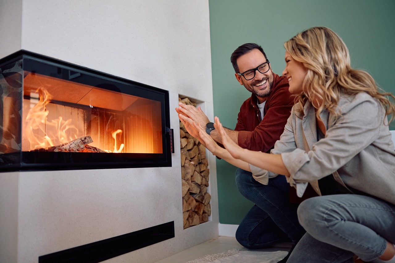 couple keeping warm by the fireplace indoors 2026 09 23 00 25 56 utc Duzy