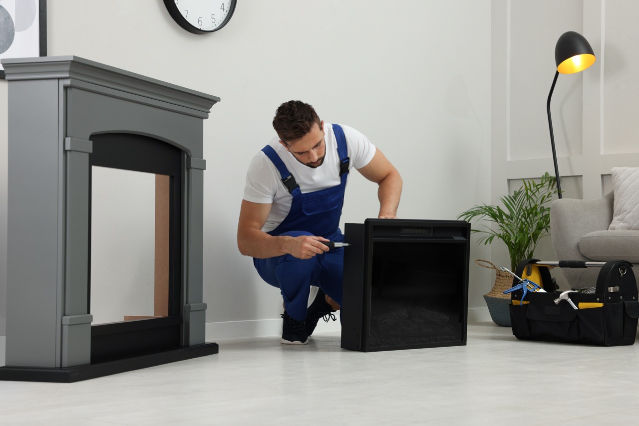 man repairing fireplace with tools in home setting 2026 09 25 01 30 28 utc Duzy